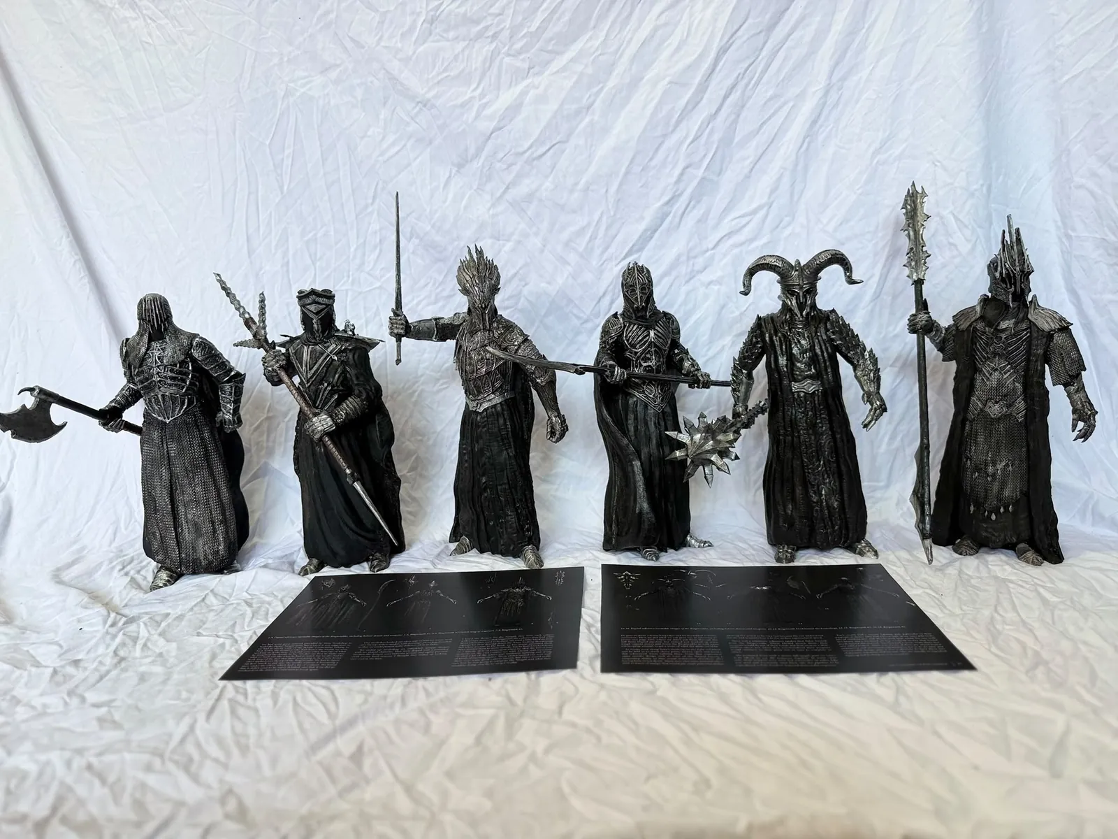 Six Nazgûl figurines with weapons