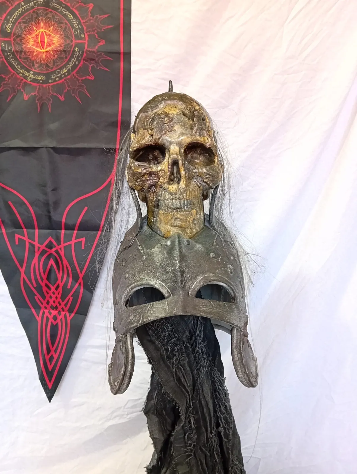 Helmet with a skull and a metal face plate, front