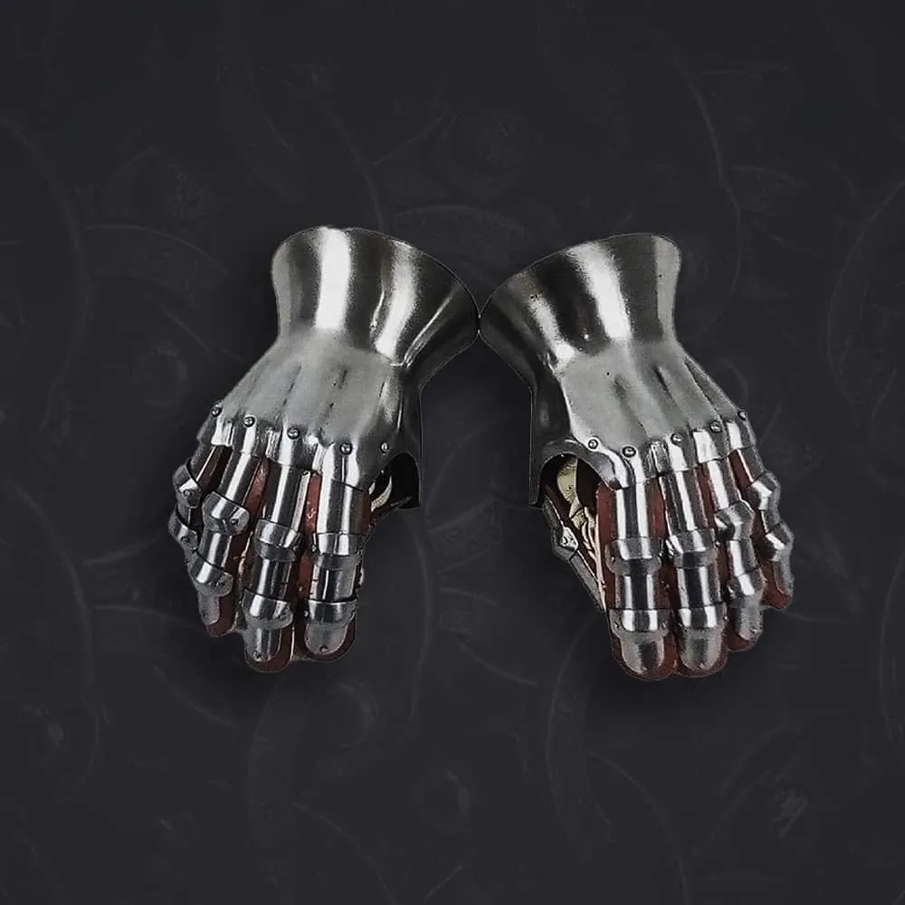 A pair of plate gauntlets on a dark background