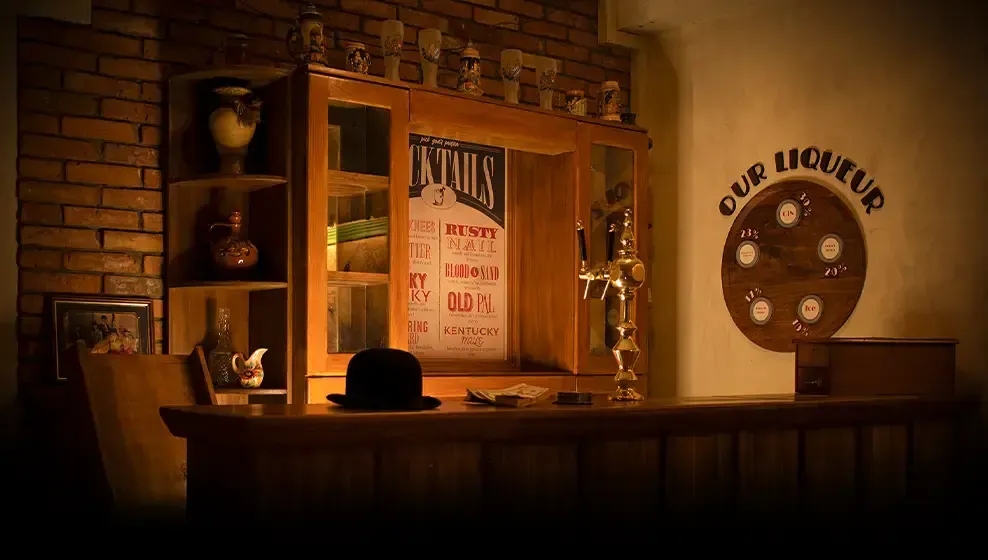 Old bar with a display cabinet, a beer tap and a cocktail menu